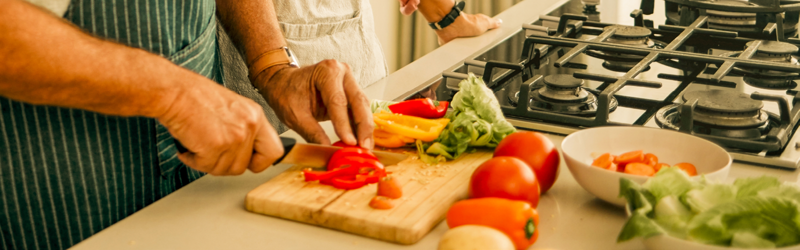 Someone chopping vegetables on a cutting board