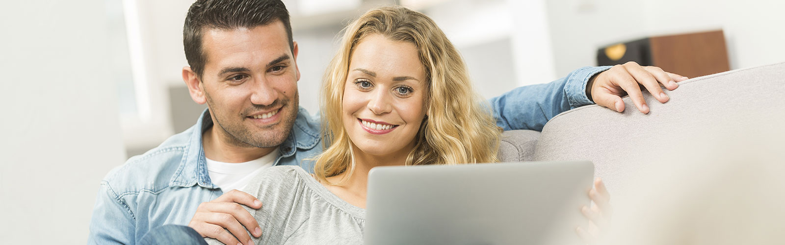 couple looks at laptop