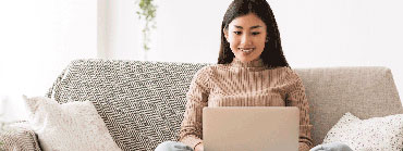 woman uses laptop for an online doctor visit