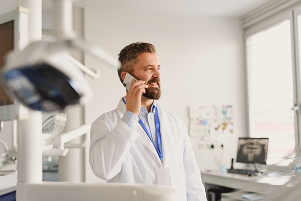 Dentist on the phone in an office