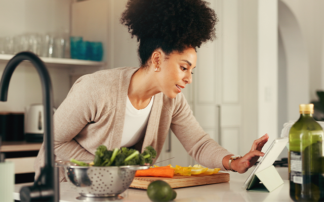 Woman making food at a kitchen counter