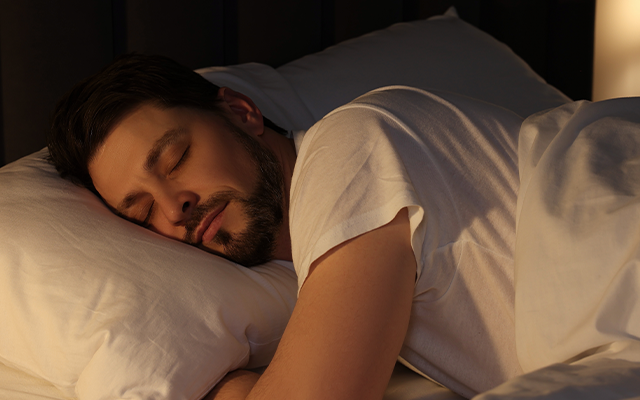 Man sleeping in bed